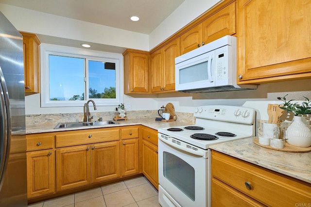 942 Royal Tern Way, Oceanside, CA 92057 - kitchen featuring white appliances, brown cabinetry, light tile patterned floors, and recessed lighting