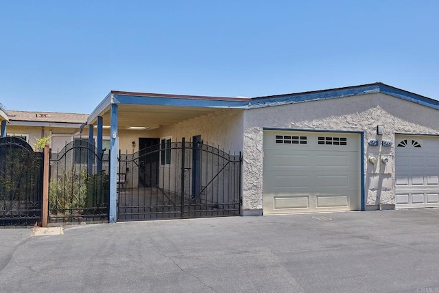 942 Royal Tern Way, Oceanside, CA 92057 - view of front of home with a gate, stucco siding, and a garage