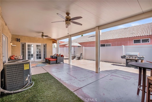 13180 Meteor Dr, Victorville, CA 92395 - view of patio featuring french doors, a grill, and a ceiling fan