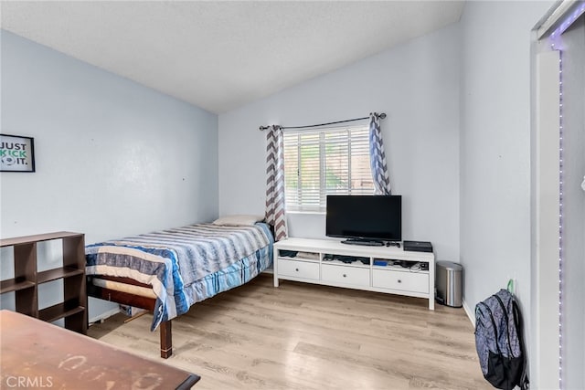 13180 Meteor Dr, Victorville, CA 92395 - bedroom with lofted ceiling and wood finished floors