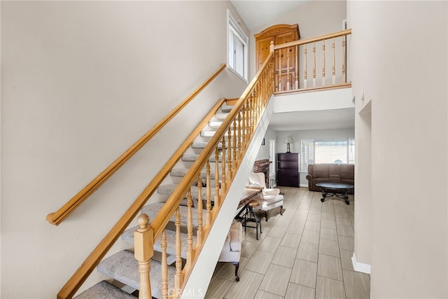 13180 Meteor Dr, Victorville, CA 92395 - stairway with a high ceiling and baseboards