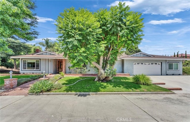 1719 Turnbull Canyon Rd, Hacienda Heights, CA 91745 - ranch-style house with a garage, a front yard, concrete driveway, and a chimney