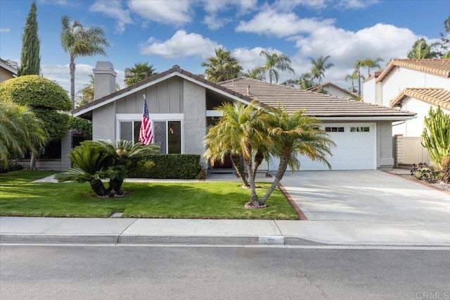 4772 Gateshead Rd, Carlsbad, CA 92010 - view of front of house featuring concrete driveway, a garage, a tiled roof, a chimney, and stucco siding