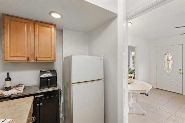 4772 Gateshead Rd, Carlsbad, CA 92010 - kitchen featuring freestanding refrigerator, light tile patterned floors, and light countertops