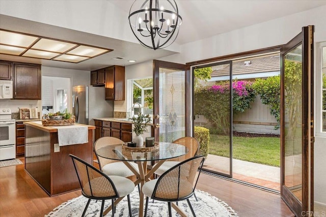 4772 Gateshead Rd, Carlsbad, CA 92010 - dining room featuring light wood-type flooring and a chandelier