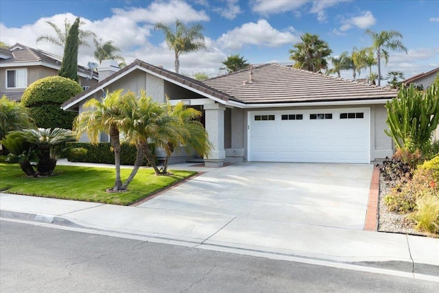 4772 Gateshead Rd, Carlsbad, CA 92010 - view of front of property with a tile roof, a garage, driveway, a front yard, and stucco siding