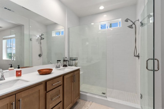 39381 Corvina Ln, Temecula, CA 92591 - bathroom with a shower stall, double vanity, and plenty of natural light