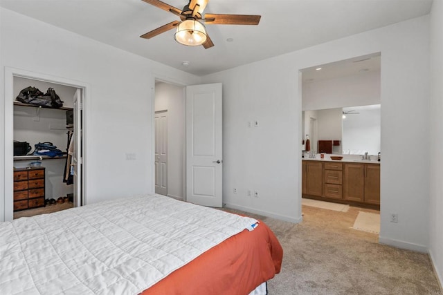 39381 Corvina Ln, Temecula, CA 92591 - bedroom featuring light carpet, connected bathroom, a closet, a walk in closet, and ceiling fan
