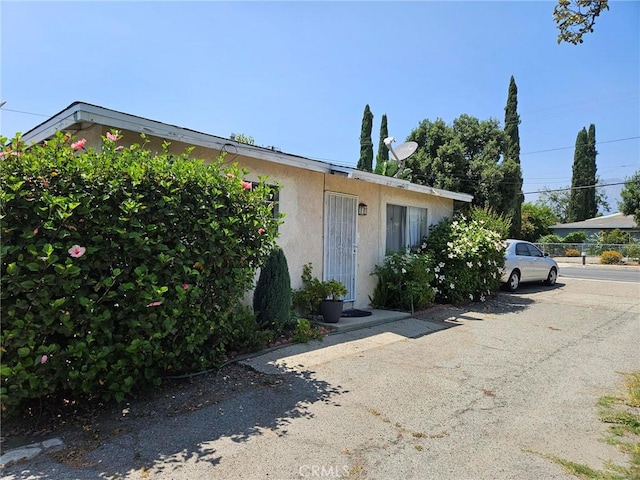 8255 9th St, Rancho Cucamonga, CA 91730 - view of front of property with stucco siding