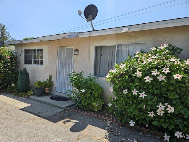 8255 9th St, Rancho Cucamonga, CA 91730 - view of exterior entry featuring stucco siding
