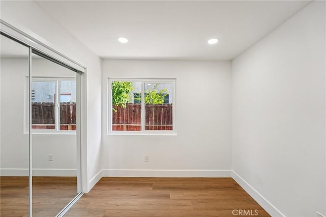 7652 Plumaria, Fontana, CA 92336 - unfurnished bedroom featuring a closet, light wood finished floors, and recessed lighting