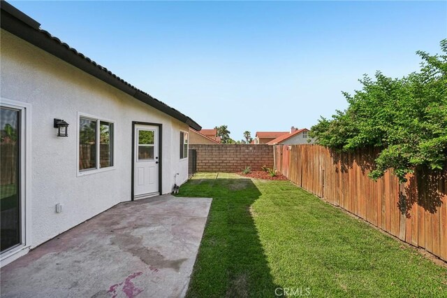 7652 Plumaria, Fontana, CA 92336 - fenced backyard with a patio