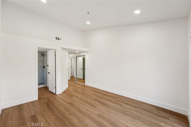 7652 Plumaria, Fontana, CA 92336 - unfurnished room with recessed lighting, light wood finished floors, and lofted ceiling