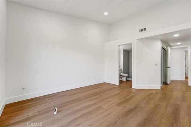 7652 Plumaria, Fontana, CA 92336 - empty room featuring wood finished floors and recessed lighting