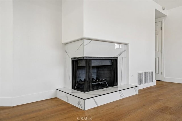 7652 Plumaria, Fontana, CA 92336 - detailed view of a tiled fireplace and wood finished floors