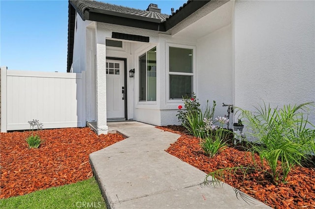 7652 Plumaria, Fontana, CA 92336 - doorway to property featuring stucco siding