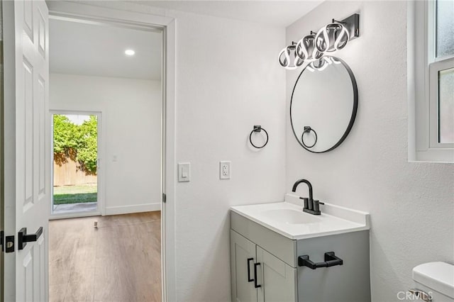 7652 Plumaria, Fontana, CA 92336 - bathroom featuring vanity, wood finished floors, and recessed lighting