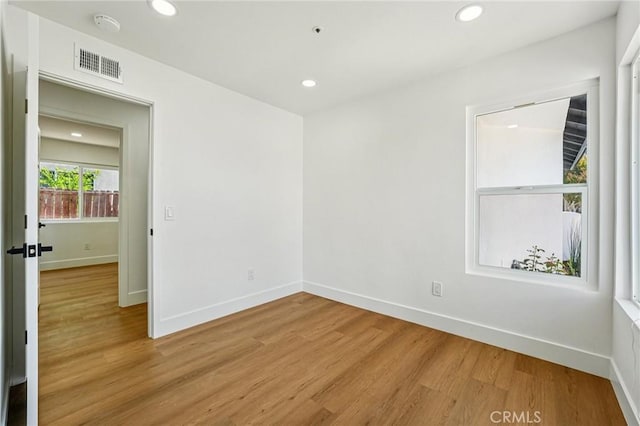 7652 Plumaria, Fontana, CA 92336 - spare room with light wood-style floors, recessed lighting, and a smoke detector