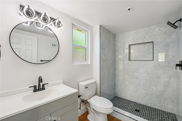 7652 Plumaria, Fontana, CA 92336 - bathroom with tiled shower, vanity, and wood finished floors