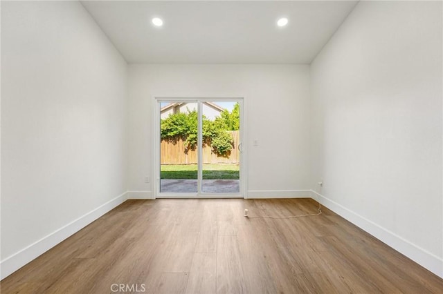 7652 Plumaria, Fontana, CA 92336 - unfurnished room with wood finished floors and recessed lighting