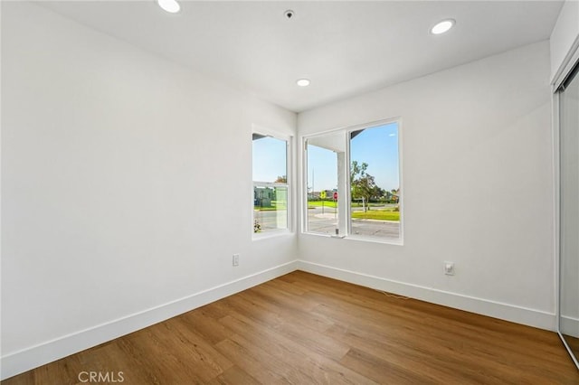7652 Plumaria, Fontana, CA 92336 - spare room featuring wood finished floors and recessed lighting
