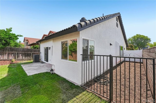7652 Plumaria, Fontana, CA 92336 - view of home's exterior with a patio, stucco siding, a fenced backyard, and a tiled roof