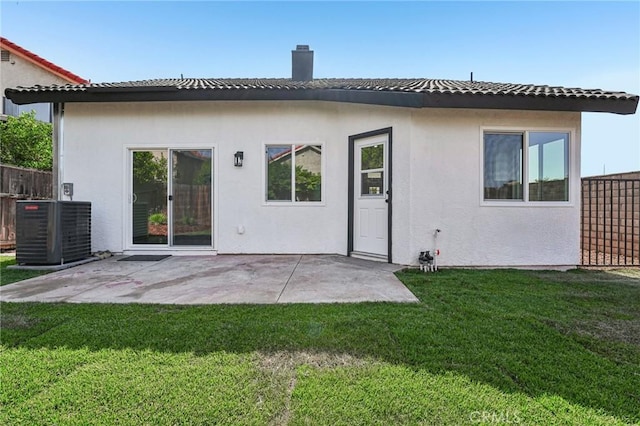 7652 Plumaria, Fontana, CA 92336 - rear view of property with stucco siding, a chimney, and a patio area