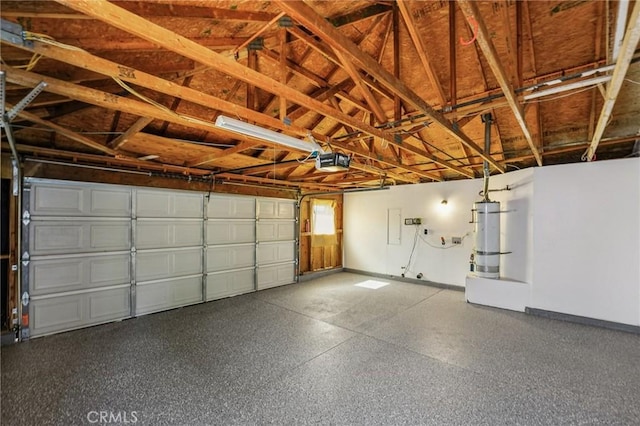 7652 Plumaria, Fontana, CA 92336 - garage featuring a garage door opener and baseboards