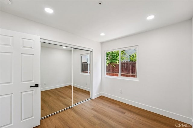 7652 Plumaria, Fontana, CA 92336 - unfurnished bedroom featuring wood finished floors, recessed lighting, and a closet