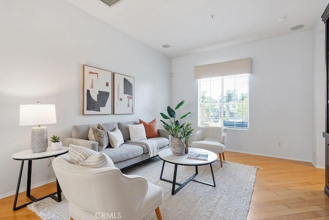 3415 S Main St Unit F, Santa Ana, CA 92707 - living area with light wood-style flooring and baseboards