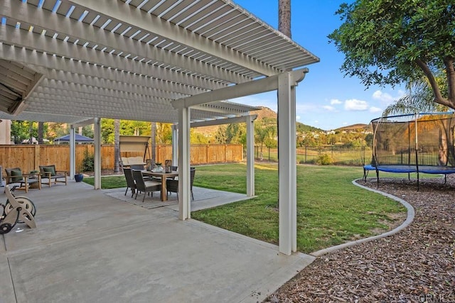 3071 Sprucewood Ln, Escondido, CA 92027 - fenced backyard with a trampoline, a pergola, a patio, and outdoor dining area