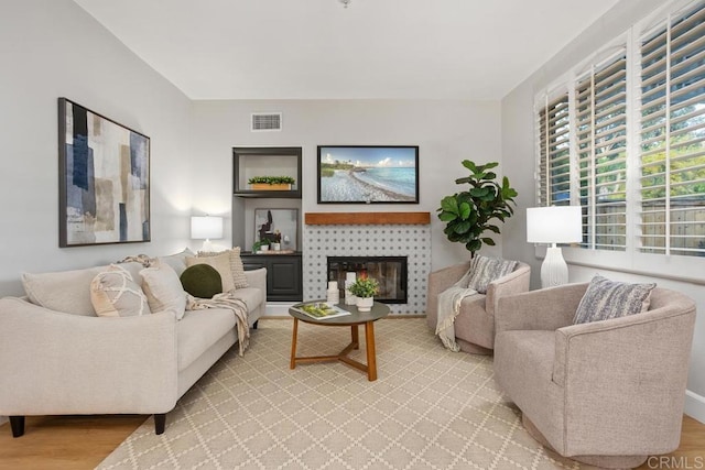 3071 Sprucewood Ln, Escondido, CA 92027 - living area featuring light wood-style floors and a fireplace