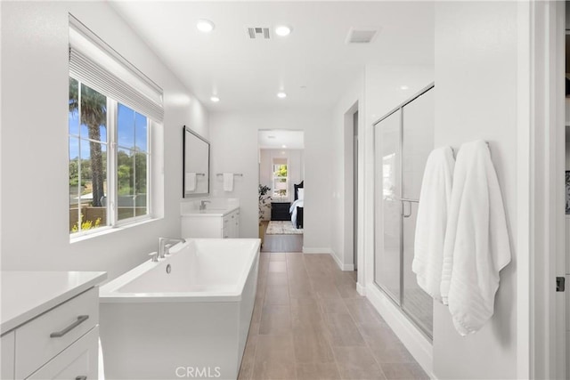 25928 Meadow Dr, San Juan Capistrano, CA 92675 - ensuite bathroom with a soaking tub, vanity, a stall shower, recessed lighting, and tile patterned floors