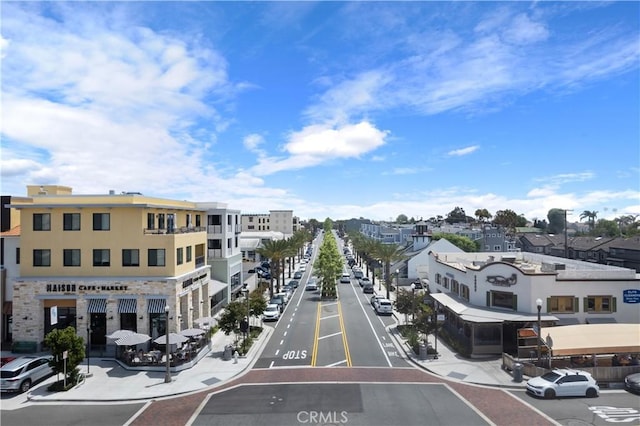 25928 Meadow Dr, San Juan Capistrano, CA 92675 - view of asphalt street with street lighting, sidewalks, and curbs