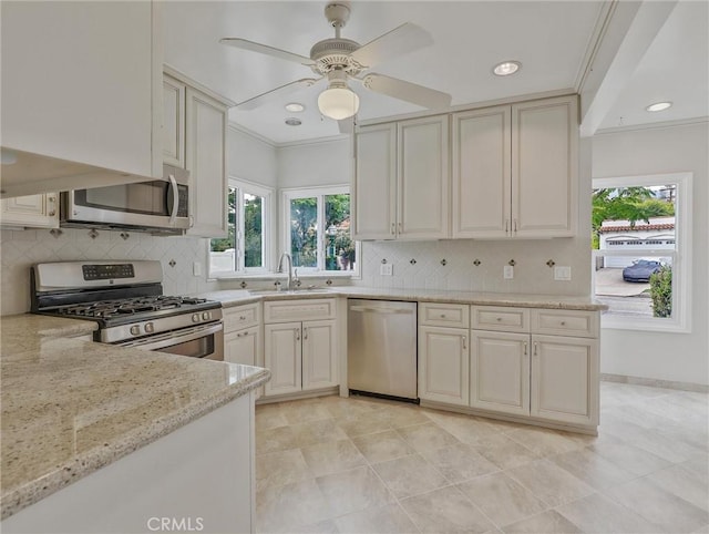 1017 Cordova Ave, Glendale, CA 91207 - kitchen with stainless steel appliances, light stone countertops, backsplash, ceiling fan, and recessed lighting