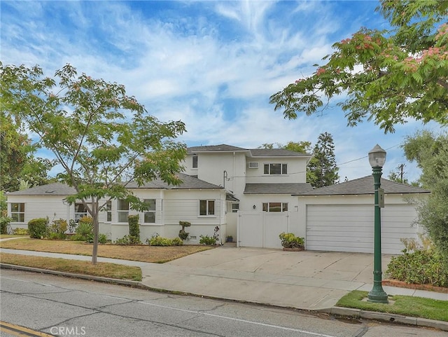 1017 Cordova Ave, Glendale, CA 91207 - traditional-style home featuring driveway, a garage, stucco siding, and a shingled roof