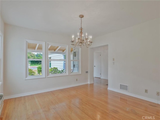 1017 Cordova Ave, Glendale, CA 91207 - empty room with a chandelier, light wood finished floors, and a baseboard radiator
