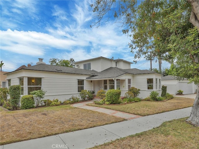 1017 Cordova Ave, Glendale, CA 91207 - view of front facade with a front lawn, a chimney, and a garage