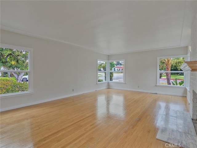 1017 Cordova Ave, Glendale, CA 91207 - empty room with a fireplace and light wood-style floors