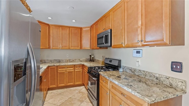 14658 Maclay St, San Fernando, CA 91345 - kitchen featuring appliances with stainless steel finishes, light tile patterned floors, light stone countertops, and recessed lighting