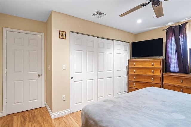 14658 Maclay St, San Fernando, CA 91345 - bedroom with light wood-style floors, a closet, and a ceiling fan