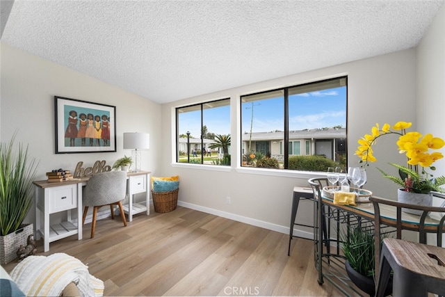 1661 Monterey Rd Unit 16G, Seal Beach, CA 90740 - office area with wood finished floors, a textured ceiling, and lofted ceiling