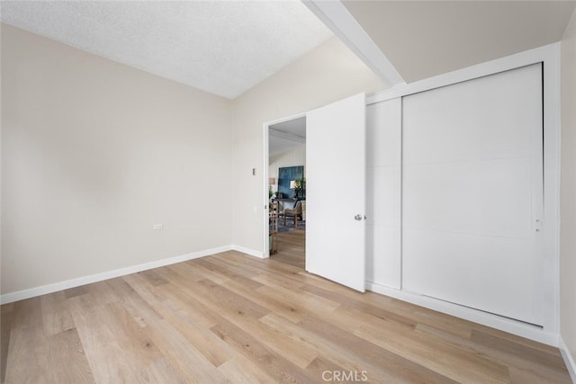 1661 Monterey Rd Unit 16G, Seal Beach, CA 90740 - unfurnished bedroom featuring light wood finished floors and a closet