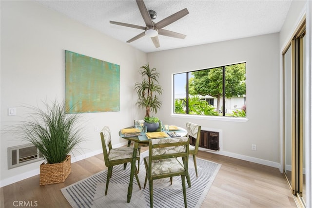 1661 Monterey Rd Unit 16G, Seal Beach, CA 90740 - dining space with ceiling fan, light wood-type flooring, and a textured ceiling