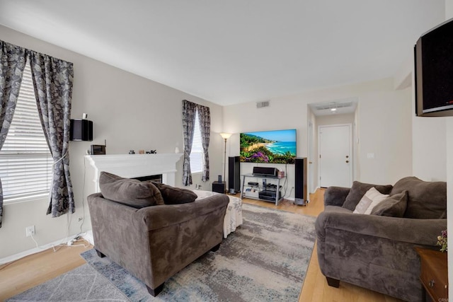 1159 Avenida Azul, San Marcos, CA 92069 - living room featuring wood finished floors and a fireplace