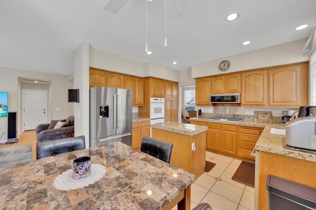 1159 Avenida Azul, San Marcos, CA 92069 - kitchen featuring a kitchen island, appliances with stainless steel finishes, light tile patterned floors, and recessed lighting