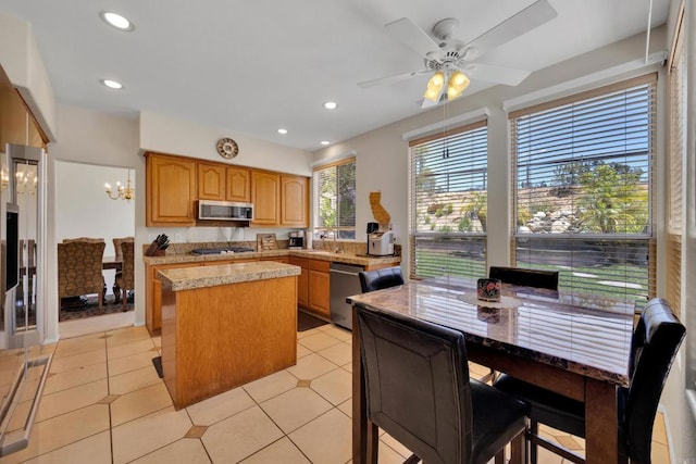 1159 Avenida Azul, San Marcos, CA 92069 - kitchen featuring stainless steel appliances, a center island, recessed lighting, ceiling fan, and a chandelier