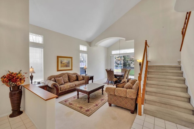 1159 Avenida Azul, San Marcos, CA 92069 - tiled living area with high vaulted ceiling, arched walkways, and stairway