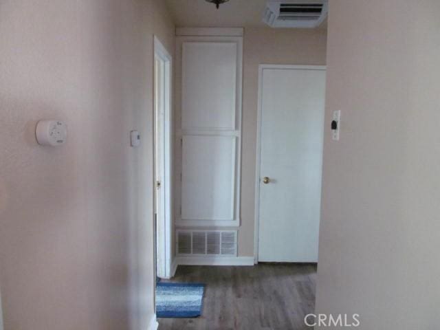 14537 Yucca St, Hesperia, CA 92345 - hall featuring wood finished floors and a wall unit AC