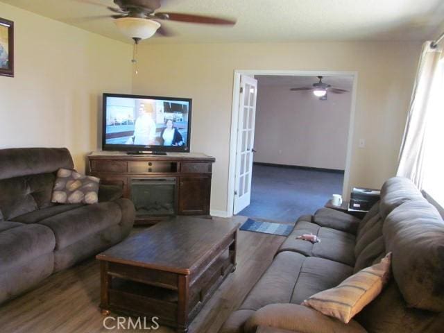 14537 Yucca St, Hesperia, CA 92345 - living room with ceiling fan, wood finished floors, and french doors